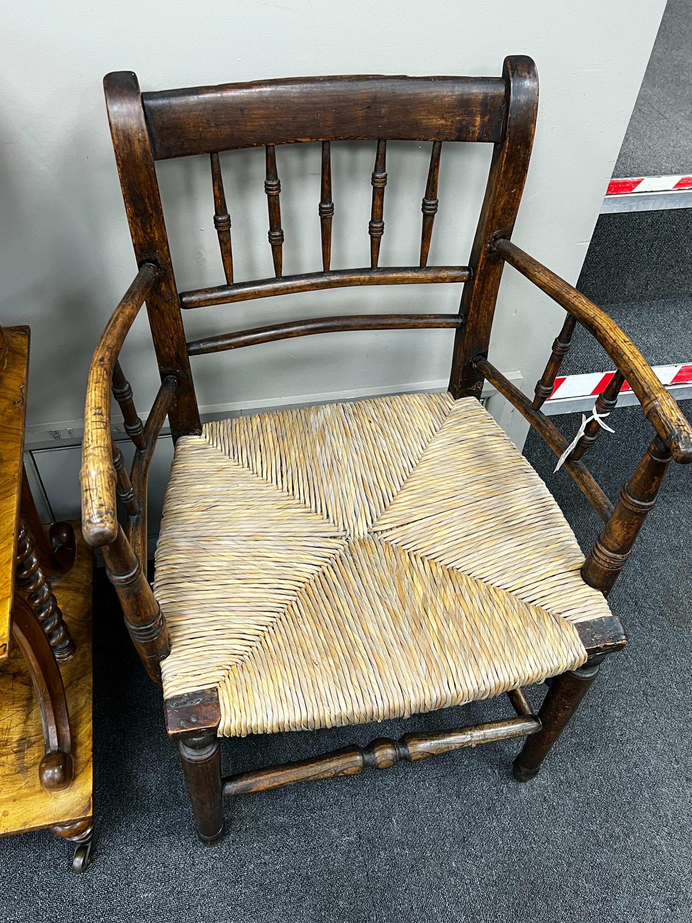 A 19th century ash and beech rush seat provincial elbow chair, width 55cm, depth 41cm, height 85cm